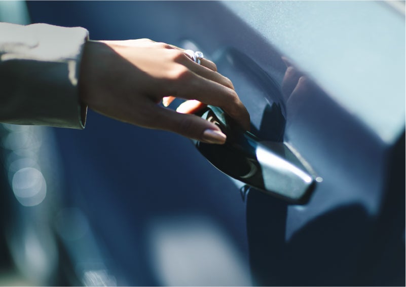 A hand gracefully grips the Light Touch Handle of a 2023 Lincoln Aviator® SUV to demonstrate its ease of use | McLarty Daniel Lincoln in Bentonville AR