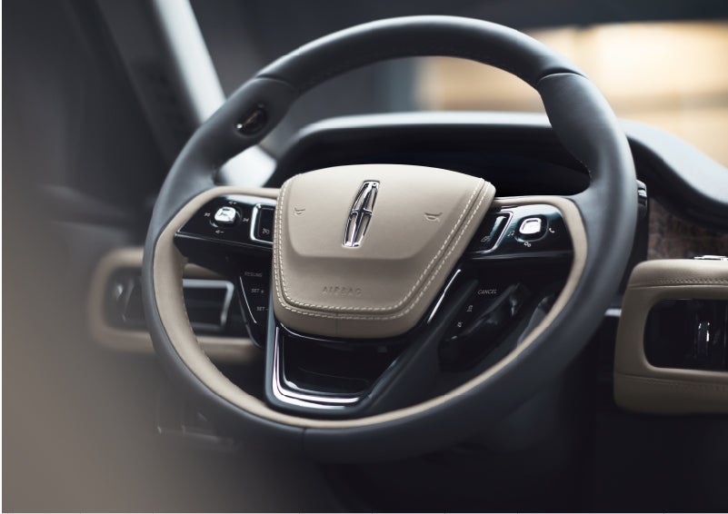 The intuitively placed controls of the steering wheel on a 2023 Lincoln Aviator® SUV | McLarty Daniel Lincoln in Bentonville AR