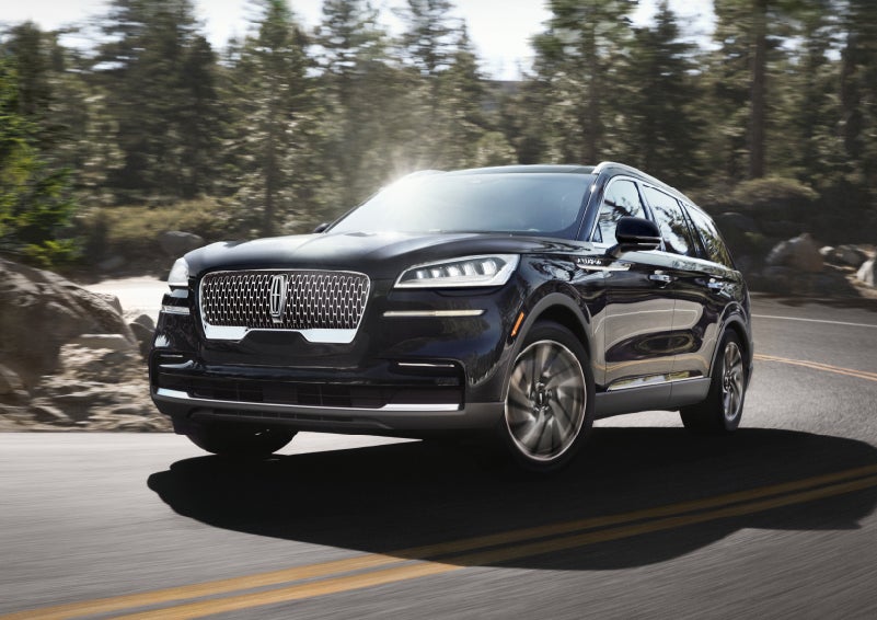 A Lincoln Aviator® SUV is being driven on a winding mountain road | McLarty Daniel Lincoln in Bentonville AR