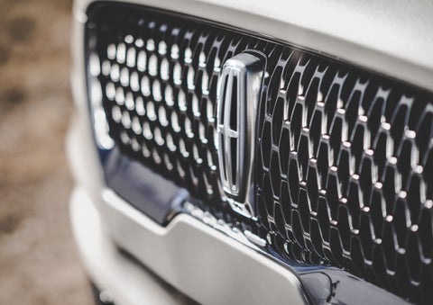 The grille of the 2024 Lincoln Aviator® Reserve model with an eye-catching repeated field of Lincoln Star logo shapes | McLarty Daniel Lincoln in Bentonville AR