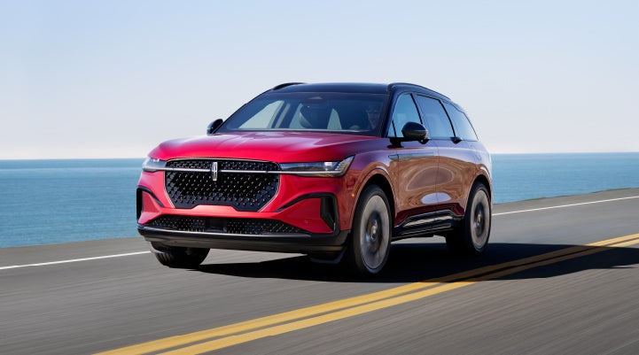 A 2024 Lincoln Nautilus® SUV is being driven on a seaside roadway. | McLarty Daniel Lincoln in Bentonville AR