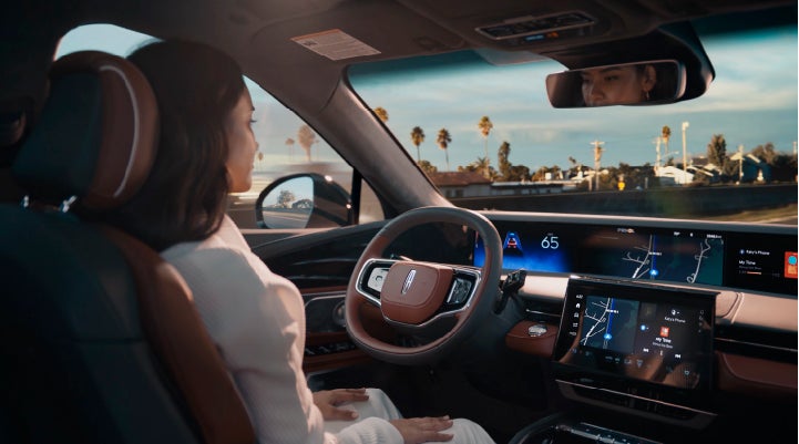 A person is shown driving hands-free on the highway with available Lincoln BlueCruise technology. | McLarty Daniel Lincoln in Bentonville AR