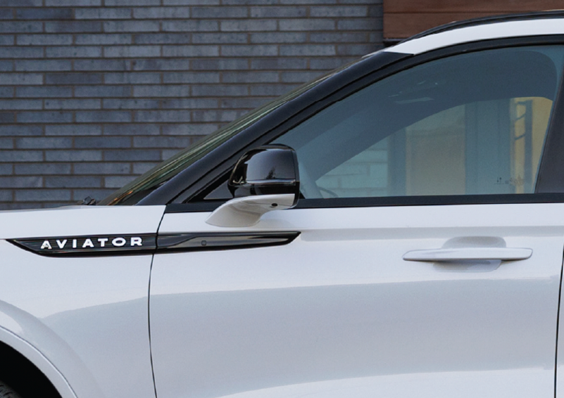 The driver’s door of a white 2025 Lincoln Aviator® SUV is showcased. | McLarty Daniel Lincoln in Bentonville AR