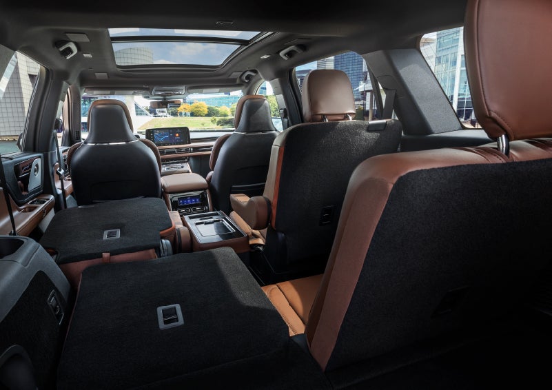 The interior of the 2025 Lincoln Aviator® SUV is shown with two seats folded down for added space. | McLarty Daniel Lincoln in Bentonville AR