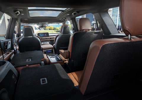 The interior of the 2025 Lincoln Aviator® SUV is shown with two seats folded down for added space. | McLarty Daniel Lincoln in Bentonville AR
