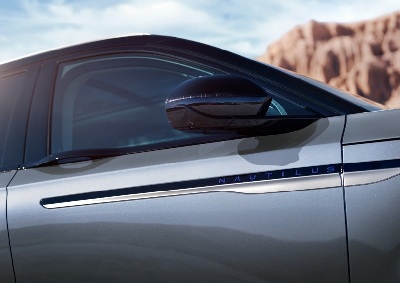 Blue lettering on the side of the vehicle that reads nautilus indicates the available hybrid powertrain. | McLarty Daniel Lincoln in Bentonville AR