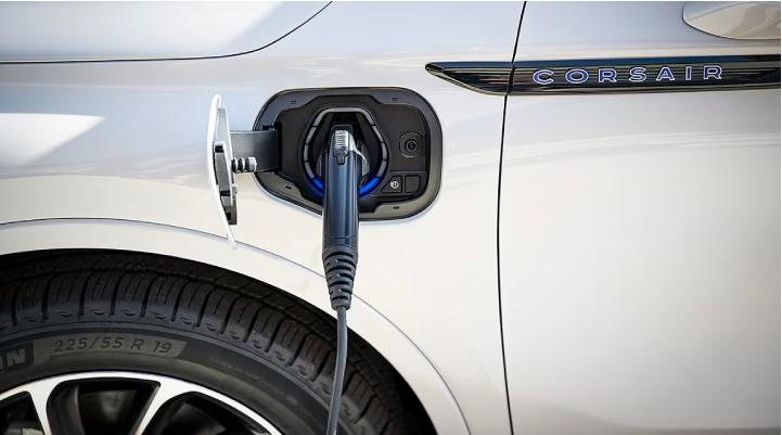 An electric charger is shown plugged into the charging port of a Lincoln Corsair® Grand Touring
model. | McLarty Daniel Lincoln in Bentonville AR