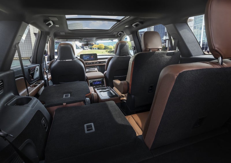 One side of the PowerFold® third-row seat and a second-row seat are folded forward in the 2026 Lincoln Aviator® SUV. | McLarty Daniel Lincoln in Bentonville AR