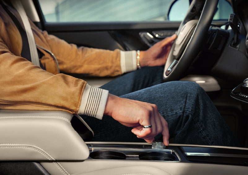 The driver of a 2026 Lincoln Corsair® SUV is shown selecting a drive mode. | McLarty Daniel Lincoln in Bentonville AR